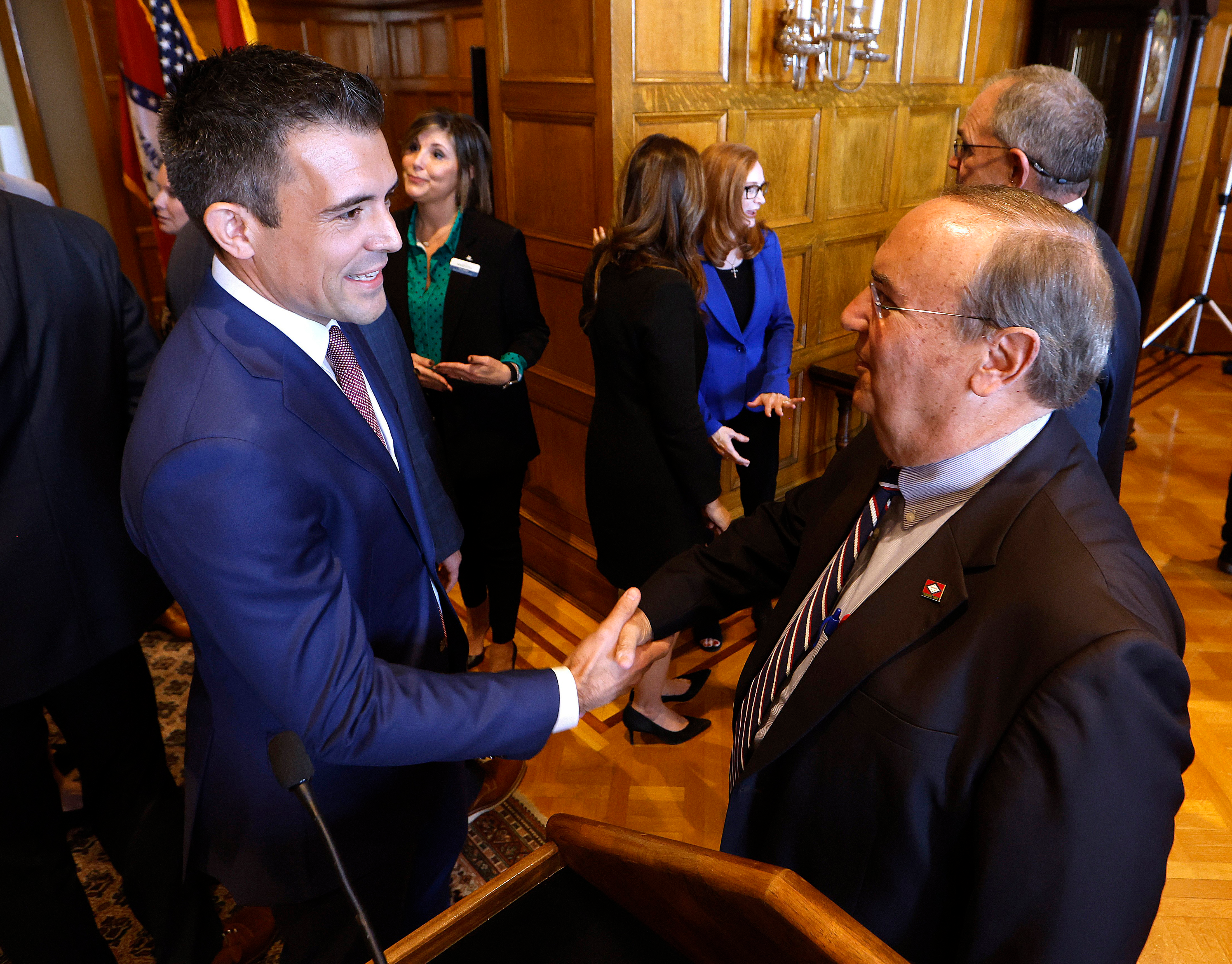 Patrick Howarth, left, global business manager, low carbon solutions for ExxonMobil, shakes hands with Sen. Mark Johnson, R-Little Rock, after an announcement of a new lithium extraction operations to start soon in south Arkansas, on Monday, Nov. 13, 2023, at the state Capitol in Little Rock, Ark.