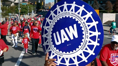 United Auto Workers members walk in the Labor Day parade in Detroit, Sept. 2, 2019.