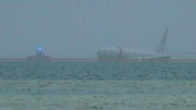 A downed U.S. Navy aircraft is seen in Kaneohe Bay, Monday, Nov. 20, 2023, in Kaneohe, Hawaii.