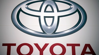 A logo of Toyota Motor Corp. at a dealer Wednesday, May 11, 2022, in Tokyo. Toyota is selling a part of its stake in components maker Denso to raise cash for its drive toward electric vehicles and other innovations, Japan's top automaker said Wednesday, Nov. 29, 2023.