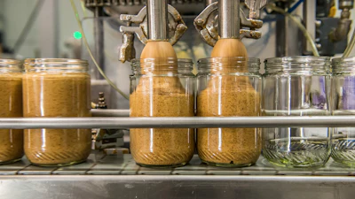 The almond butter filler at Once Again's facilities.