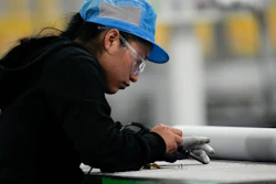 An employee at the Hanwha Qcells Solar plant, Dalton, Ga., Oct. 16, 2023.
