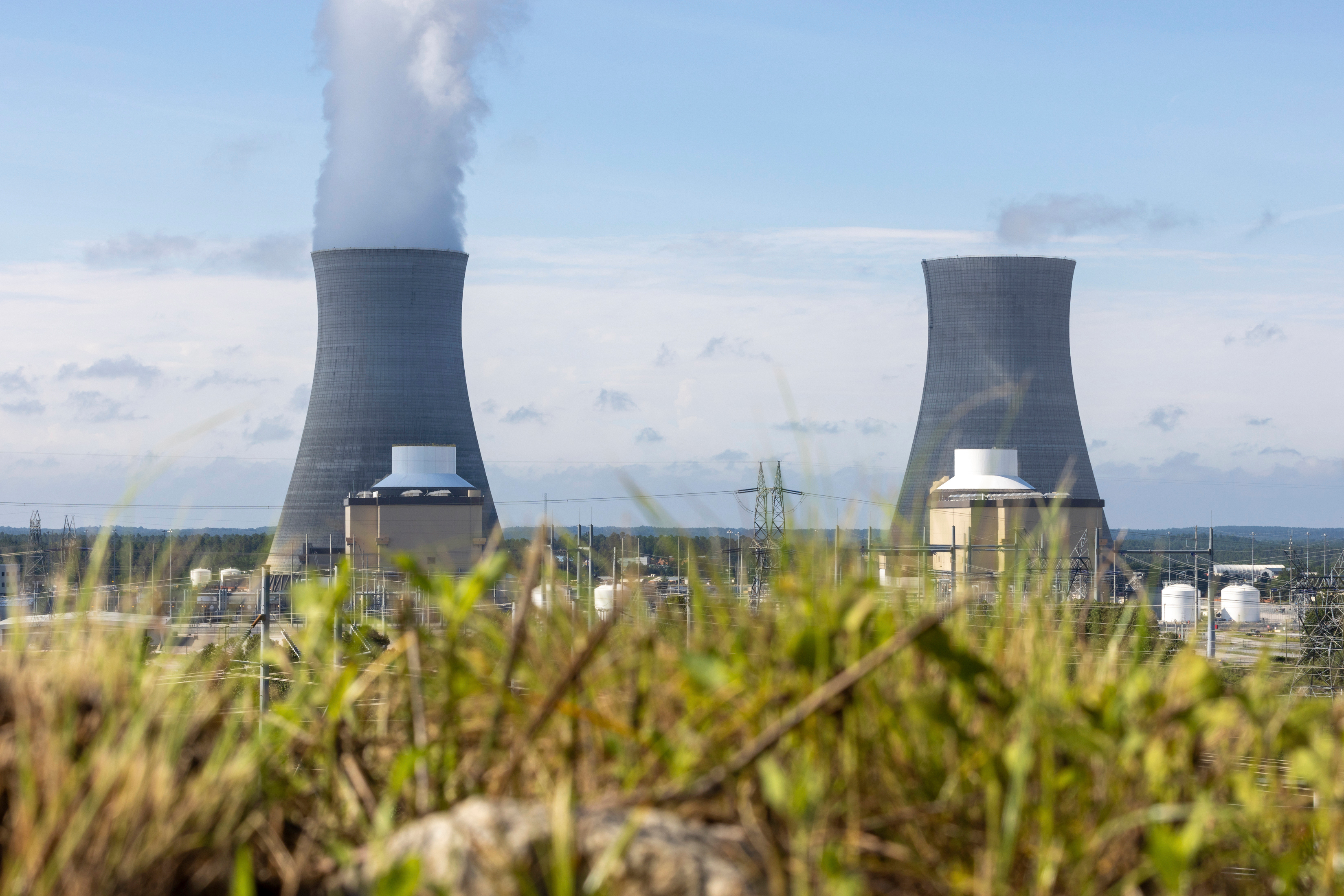 The first of two new nuclear reactors, left, operates at Plant Vogtle, July 31, 2023, in Burke County near Waynesboro, Ga., while the second reactor, right, awaits completion.