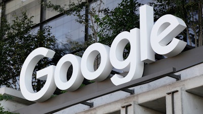 The Google sign is shown over an entrance to the company's new building in New York on Sept. 6, 2023.