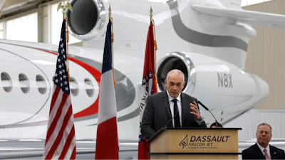 Dassault Falcon CEO Thierry Betbeze talks about the Dassault expansion as Jay Cheshire, right, president of the Little Rock, Ark., Regional Chamber of Commerce, looks on during an event at the Dassault hangar at Bill and Hillary Clinton National Airport, Tuesday, Dec. 12, 2023, in Little Rock.