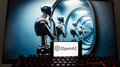 The OpenAI logo is seen displayed on a cell phone with an image on a computer screen generated by ChatGPT's Dall-E text-to-image model, Friday, Dec. 8, 2023, in Boston.