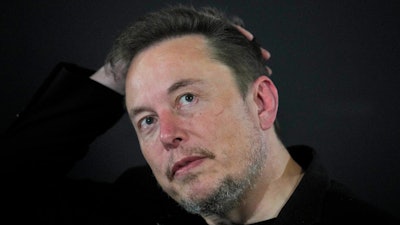 Elon Musk appears at an event with Britain's Prime Minister Rishi Sunak in London, on Nov. 2, 20