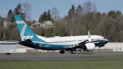 A Boeing 737 MAX 7 takes off on its first flight on March 16, 2018, in Renton, Wash.