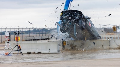 A 2022 Rivian R1T is used for a crash test research by the U.S. Army Corps of Engineers and Development Center and the University of Nebraska-Lincoln's Midwest Roadside Safety Facility on Oct. 12, 2023 in Lincoln, Neb.