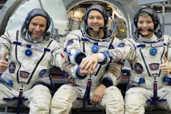From left: CSA astronaut David Saint Jacques, Russian cosmonaut Оleg Kononenko and U.S. astronaut Anne McClain pose for a photo before their final preflight practical examination in a mock-up of a Soyuz space craft at Russian Space Training Center in Star City, outside Moscow, Russia, Wednesday, Nov. 14, 2018.