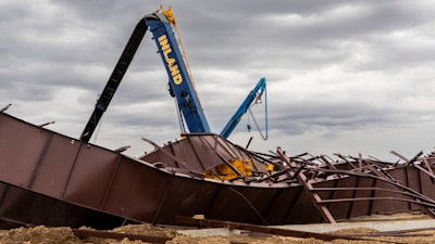 Twisted girders and debris cover the ground from a deadly structure collapse at a construction site near the Boise Airport that occurred the day before, Feb. 1, 2024, in Boise, Idaho.