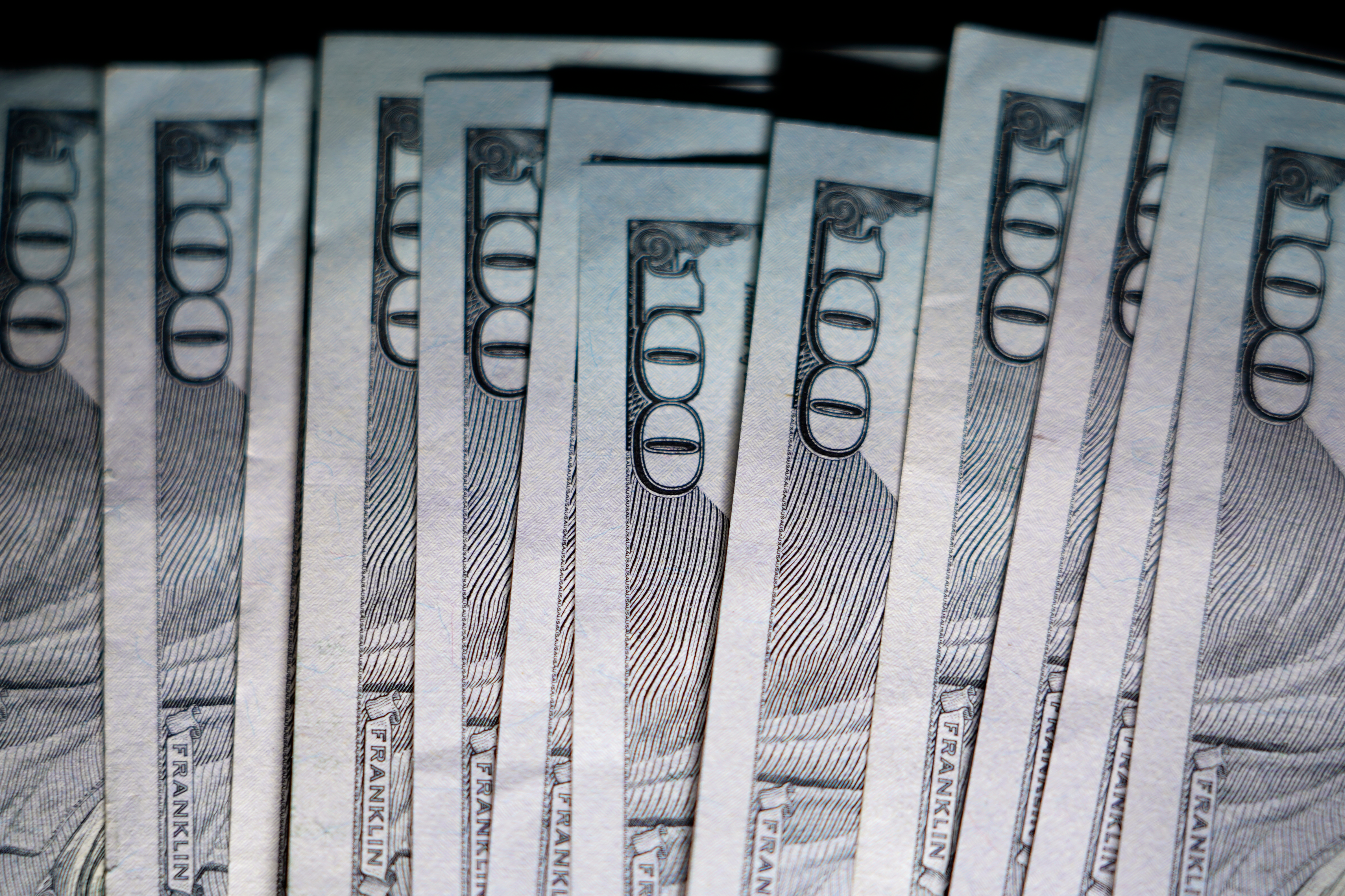 U.S. $100 bills are seen, Thursday, July 14, 2022, in Marple Township, Pa.
