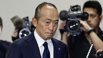 Akihiro Kobayashi, president of Kobayashi Pharmaceutical Co., arrives at a news conference in Osaka, western Japan, Friday, March 29, 2024.