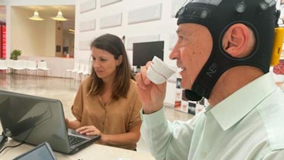 A panelist monitored during electroencephalogram recording at the International Coffee Tasting Summer Session at the Mumac Academy, Milan, Italy, July 2022.