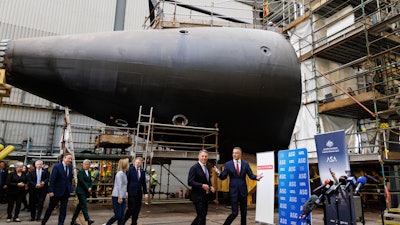 BritainÅfs Secretary of State for Defence Grant Shapps, center right, and BritainÅfs Foreign Secretary David Cameron, left, walk with the Premier of South Australia Peter Malinauskas, right, Deputy Prime Minister of Australia Richard Marles, second right, Australian Minister for Foreign Affairs Penny Wong, second left, and United StatesÅf Ambassador to Australia Caroline Kennedy, during a visit to the Osborne Naval Shipyard in Adelaide, Australia, Friday, March 22, 2024.