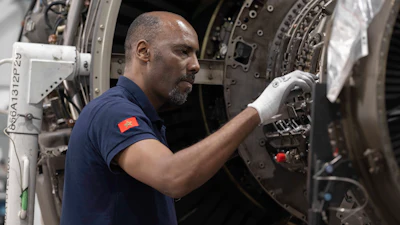 A worker repairs aircraft parts inside Safran Aircraft Engines repair plant outside of Casablanca, Morocco, Thursday, April 18, 2024.