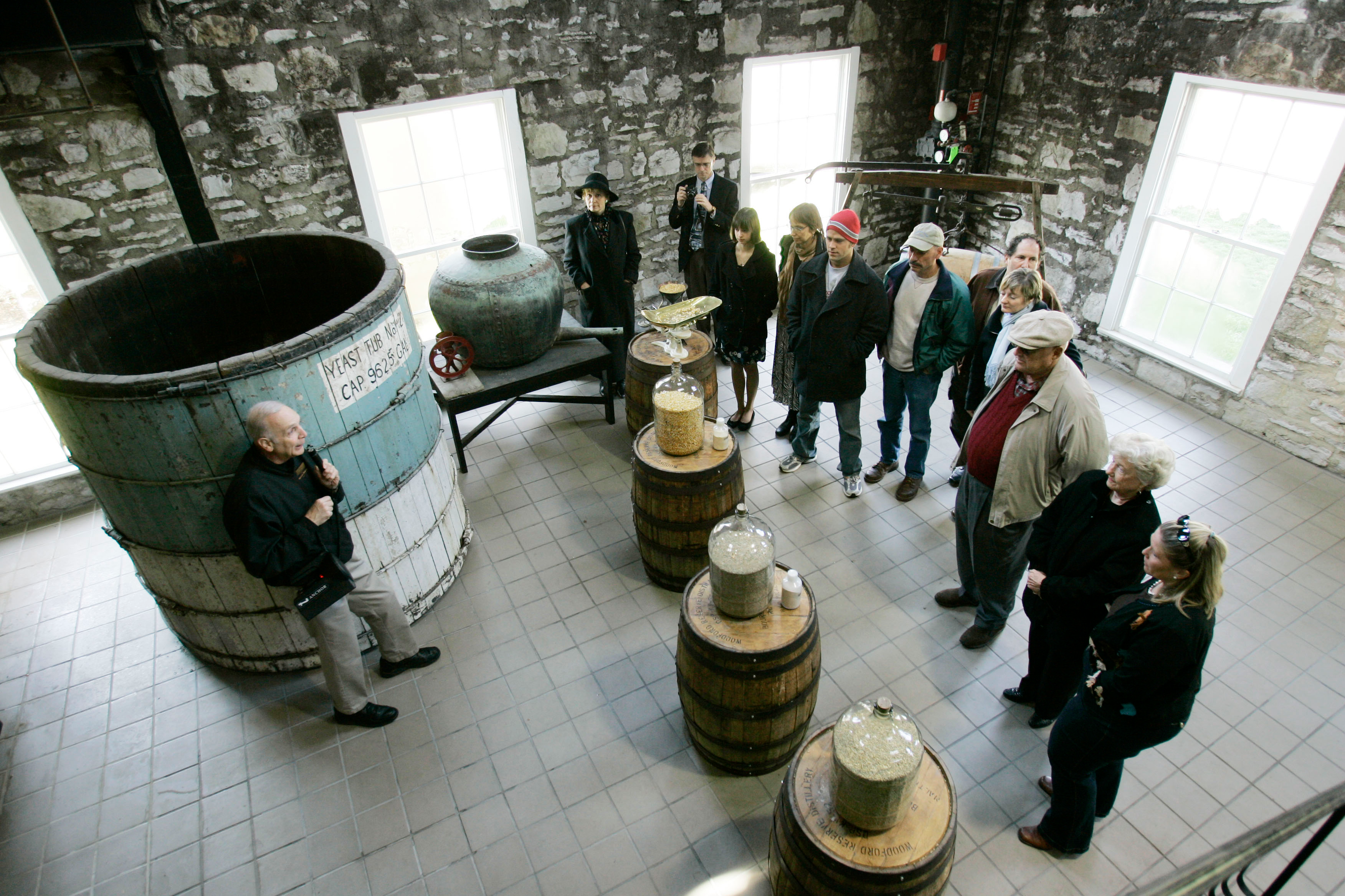 Guide Dave Salyers describes the bourbon-making process to a group touring the Woodford Reserve distillery, Versailles, Ky., April 8, 2009.