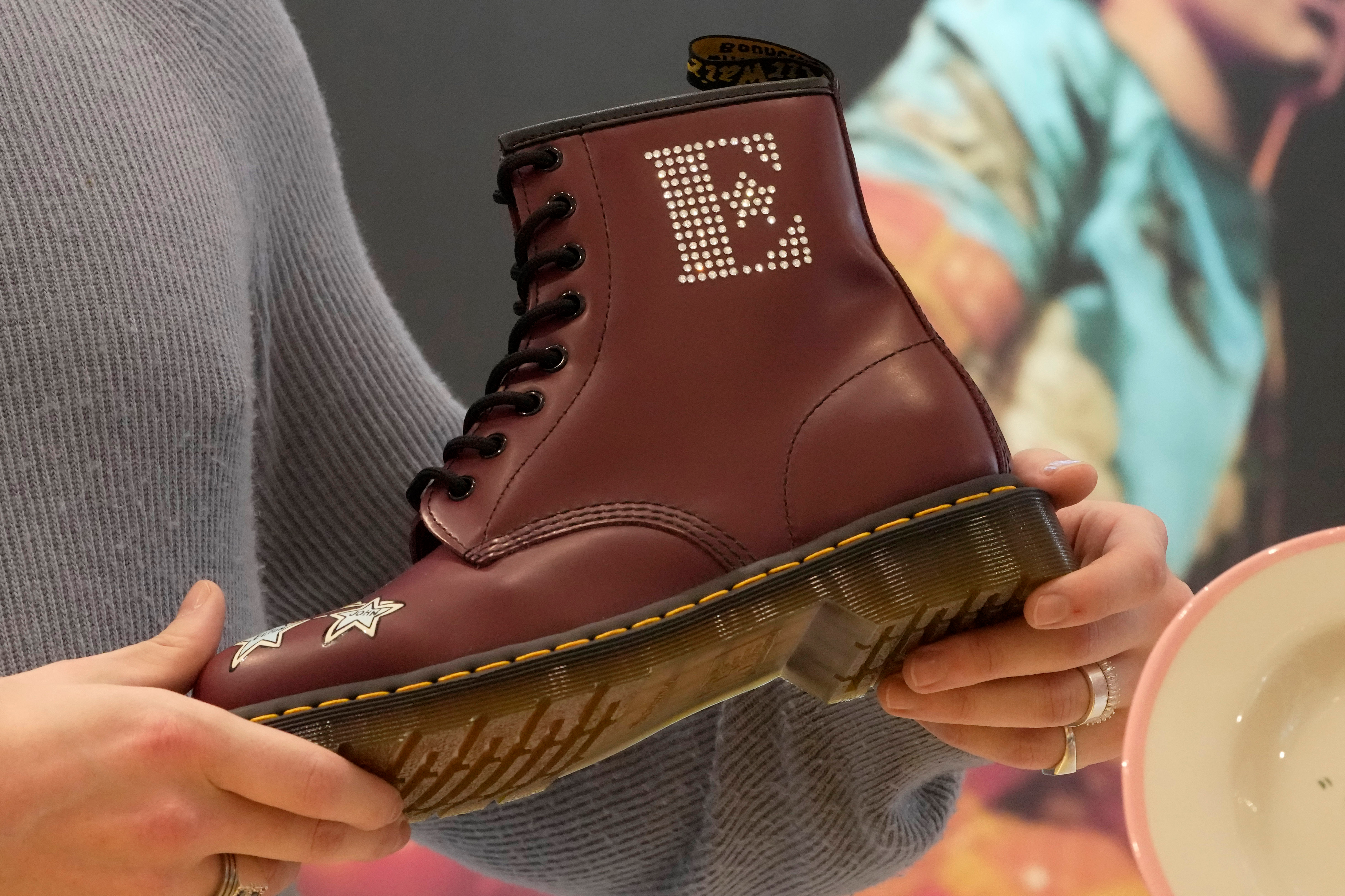 A Dr Martens boot inspired by Elton John's famous Pinball Wizard outfit is shown at a promotional event in London, March 20, 2023.