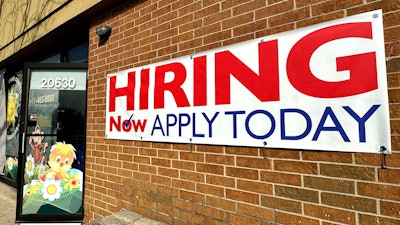 A hiring sign is displayed in Riverwoods, Ill., Tuesday, April 16, 2024.