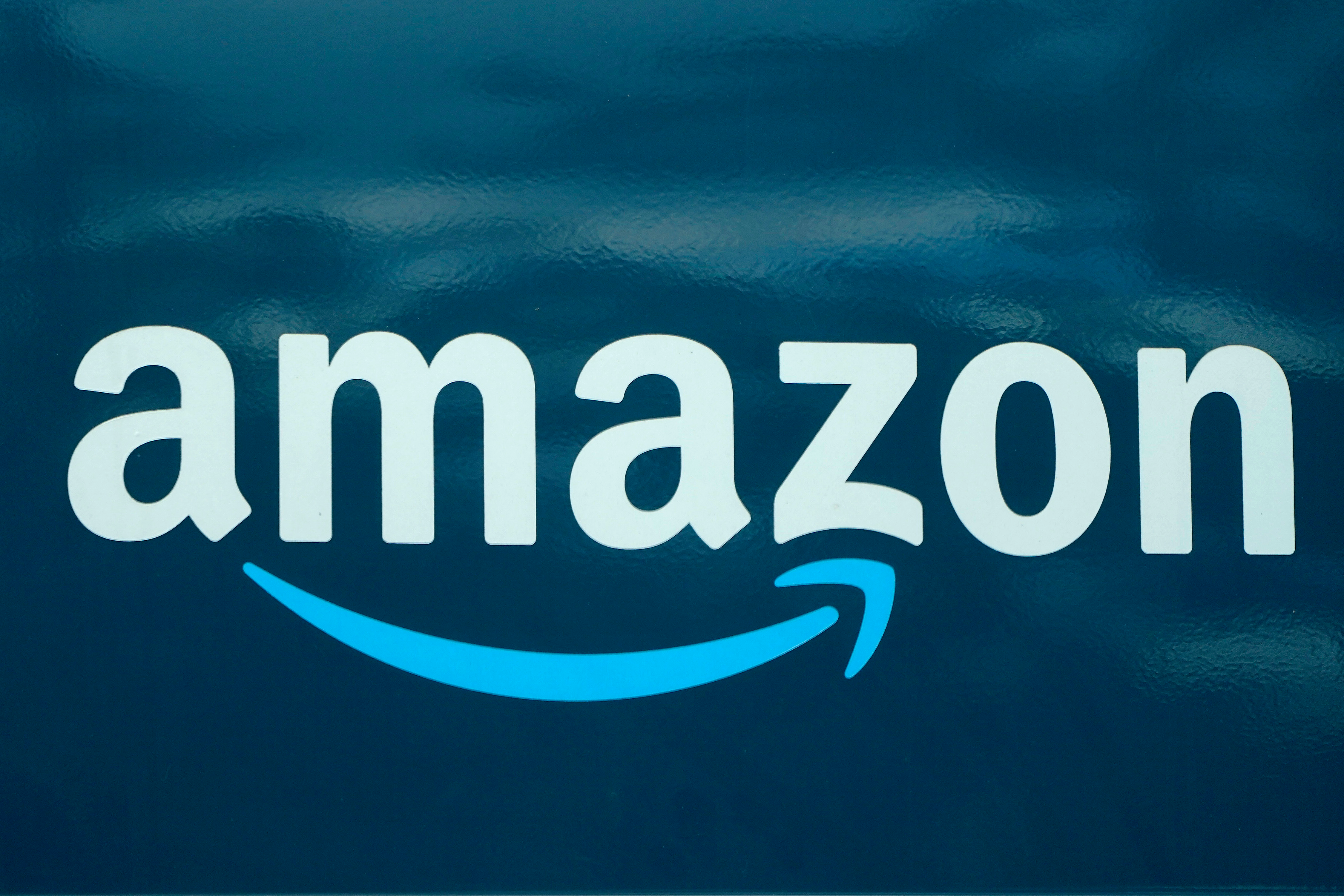 An Amazon logo appears on an Amazon delivery van in Boston, Oct. 1, 2020.