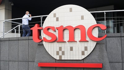 A person walks into the Taiwan Semiconductor Manufacturing Co., headquarters in Hsinchu, Taiwan on Oct. 20, 2021.