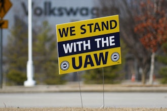 A 'We stand with the UAW' sign appears outside of the Volkswagen plant in Chattanooga, Tenn., on Dec. 18, 2023.