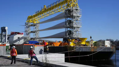 A generator and blades head for the South Fork Wind farm from New London, Conn., on Dec. 4, 2023.