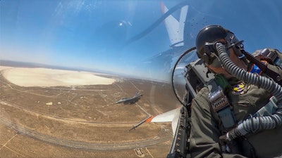 This image from remote video released by the U.S. Air Force shows Air Force Secretary Frank Kendall during his experimental flight inside the cockpit of a X-62A VISTA aircraft autonomous warplane above Edwards Air Base, Calif, on Thursday, May 2, 2024. The AI-controlled flight is serving as a public statement of confidence in the future role of AI in air combat.