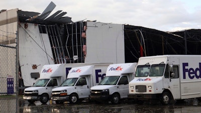 FedEx trucks outside a damaged FedEx facility in Portage, Mich., May 7, 2024.