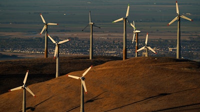 Wind turbines work in Livermore, Calif., Aug. 10, 2022.
