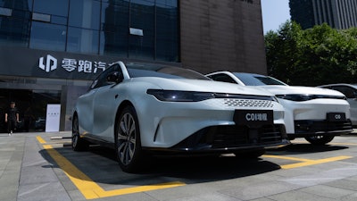 Leapmotor vehicles are parked outside a showroom in Hangzhou in eastern China's Zhejiang province on Tuesday, May 14, 2024.