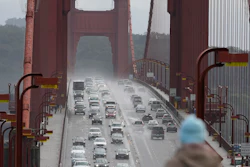 A person watches as traffic drives across the Golden Gate Bridge in Sausalito, Calif., on March 1, 2024.
