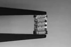 Researchers developed a new 3D printing method called blurred tomography that can rapidly produce microlenses with commercial-level optical quality. They used the technique to print a microlens array, which is shown being held by a set of tweezers.