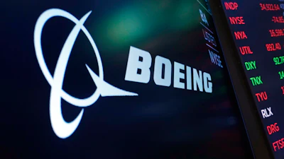 The logo for Boeing appears on a screen above a trading post on the floor of the New York Stock Exchange, July 13, 2021.