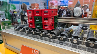 A model of a Heineken Brasil conveyor belt with lubrication-free polymer bearings on display at Hannover Messe 2024.