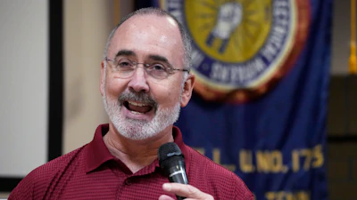 United Auto Workers President Shawn Fain speaks to Volkswagen auto workers, April 19, 2024, in Chattanooga, Tenn., after workers at a VW factory voted to join the UAW.