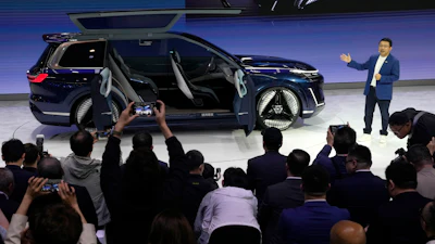 Jerry Gan, CEO of Geely Auto Group unveils the Galaxy Starship a new technology flagship AI-driven SUV prototype during Auto China 2024 in Beijing, Thursday, April 25, 2024.