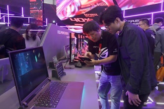 Visitors review new computer products during the Computex Taipei exhibition.