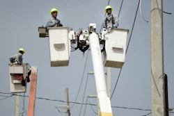 Puerto Rico Electric Power Authority workers repair distribution lines damaged by Hurricane Maria in the Cantera community of San Juan, Puerto Rico.