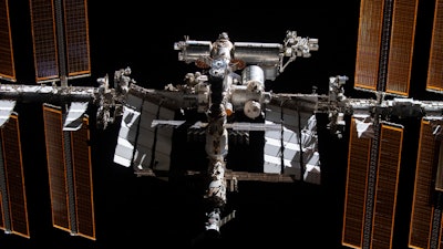 This photo provided by NASA shows the International Space Station from the SpaceX Crew Dragon Endeavour during a fly around of the orbiting lab.
