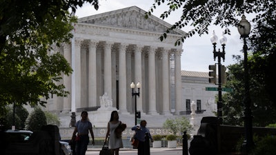 People walk past the Supreme Court on Thursday, June 27, 2024, in Washington.