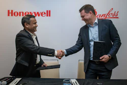 Honeywell Process Solutions President Pramesh Maheshwari, left, and Danfoss Power Electronics and Drives President Mika Kulju.