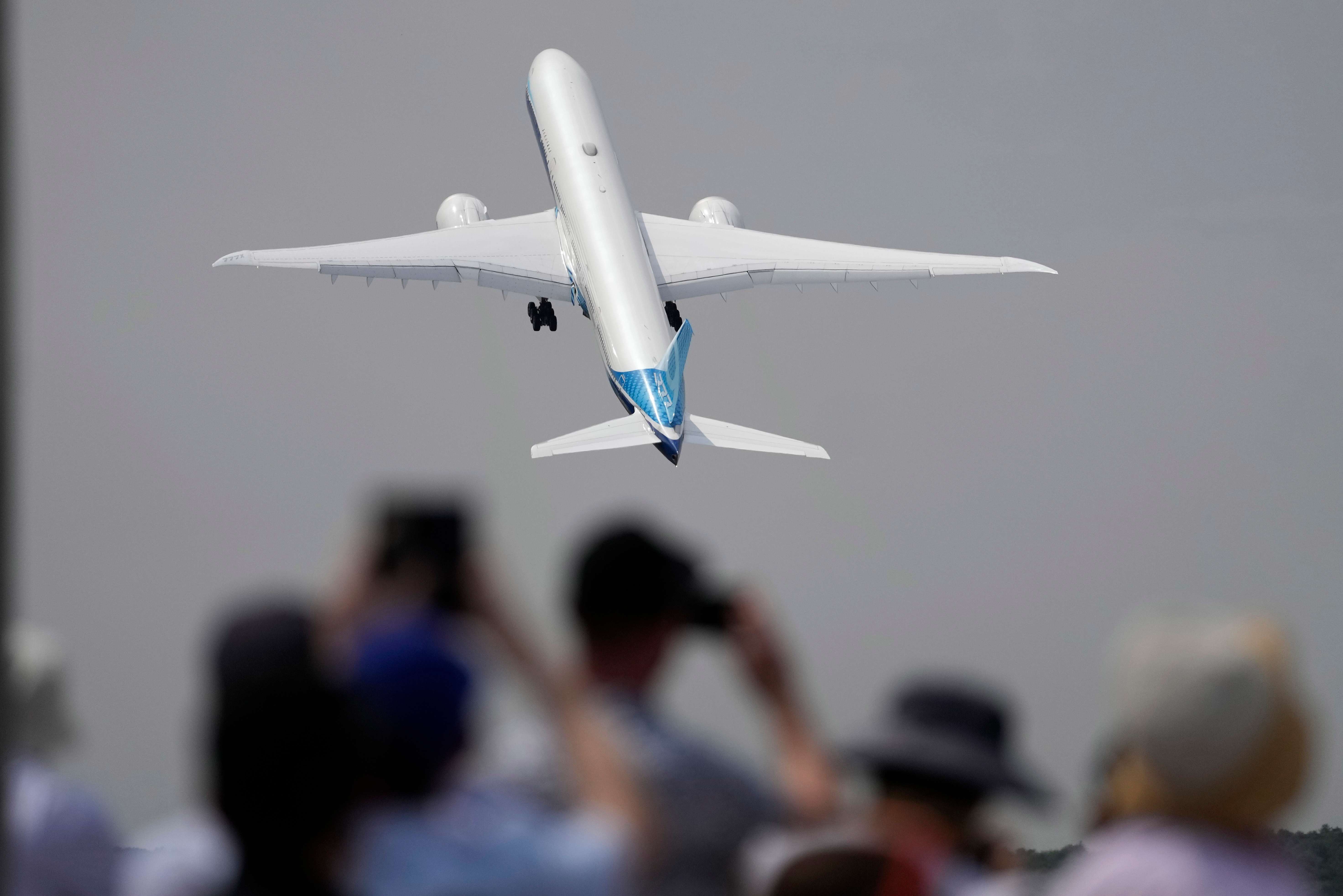A Boeing 777X plane takes off at the Farnborough Air Show fair in Farnborough, England, on July 18, 2022.