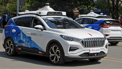Baidu Apollo Robotaxis move on a street at the Shougang Park in Beijing.