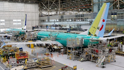 A Boeing 737 MAX aircraft is shown on the assembly line at the Boeing facility in Renton, Wash.