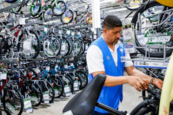 A worker organizes bicycles at a Walmart Superstore, Secaucus, N.J., July 11, 2024.