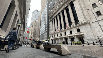 People pass the New York Stock Exchange on July 30, 2024 in New York.