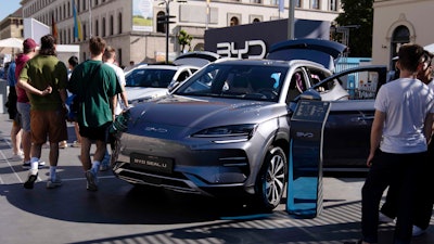 Visitors watch a BYD Seal U car at the IAA motor show in Munich, Germany.