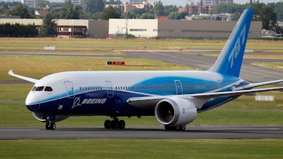 The Boeing 787 Dreamliner taxis after its landing at Le Bourget airport, east of Paris, upon its presentation for the first time at the 49th Paris Air Show at the airport, June 21, 2011.