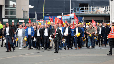 Federal Chancellor Olaf Scholz, front 4th from left, visits the Meyer Werft shipyard in Papenburg, Germany, Thursday Aug. 22, 2024.